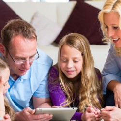 family-around-tablet