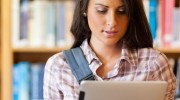 woman-in-library-with-tablet
